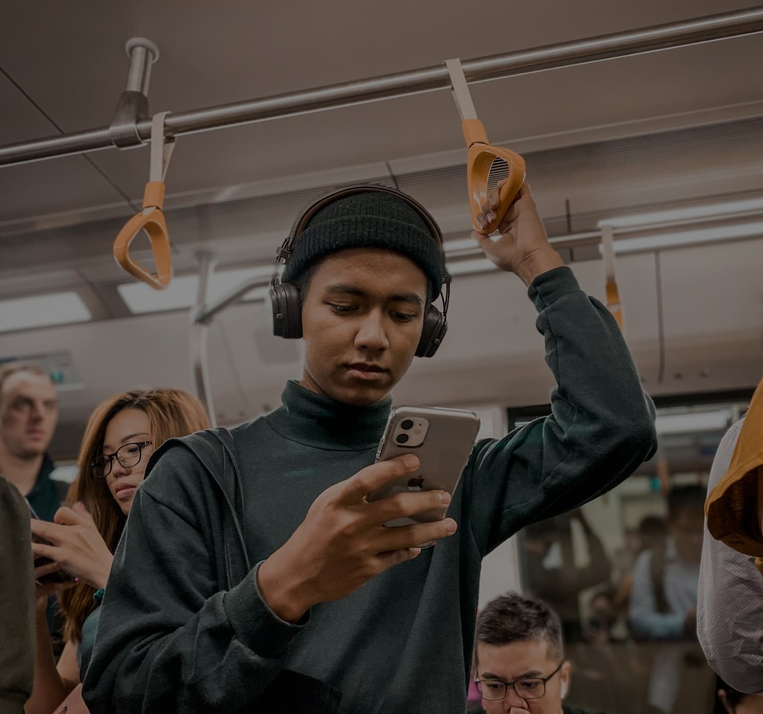 A commuter using a phone